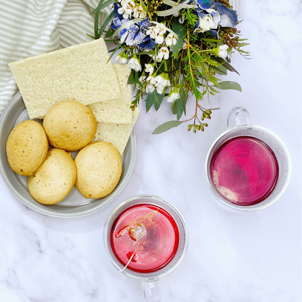 colorful pink tea served with cookies