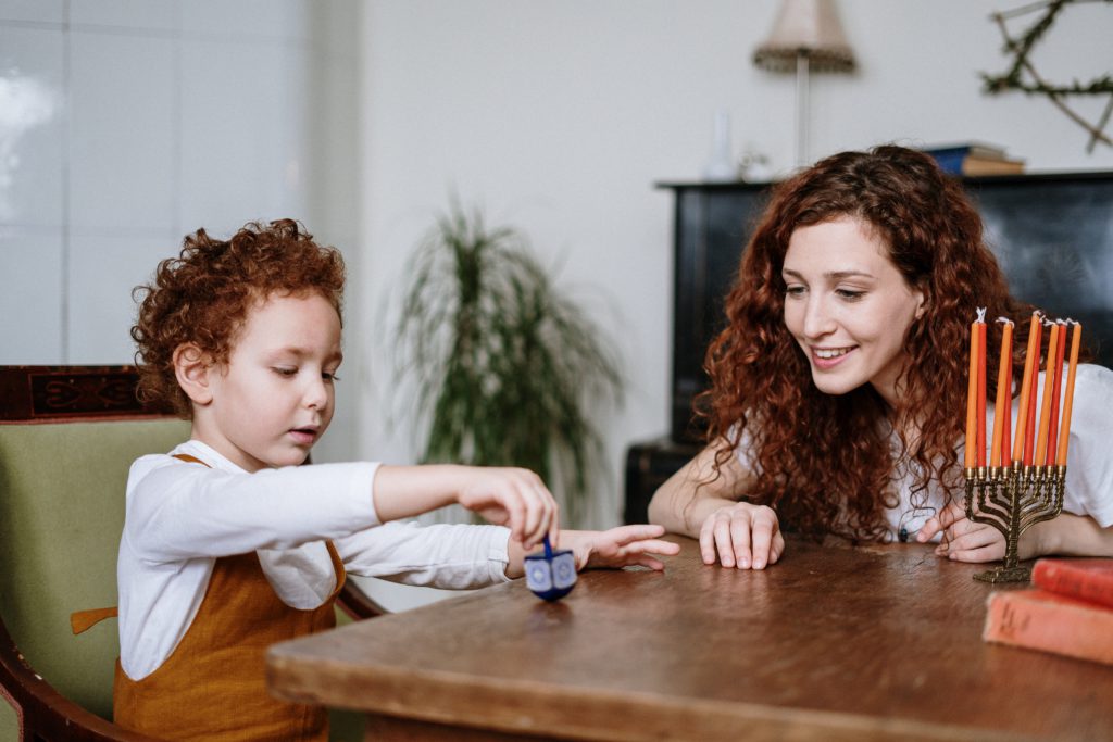 Child playing with Dreidel