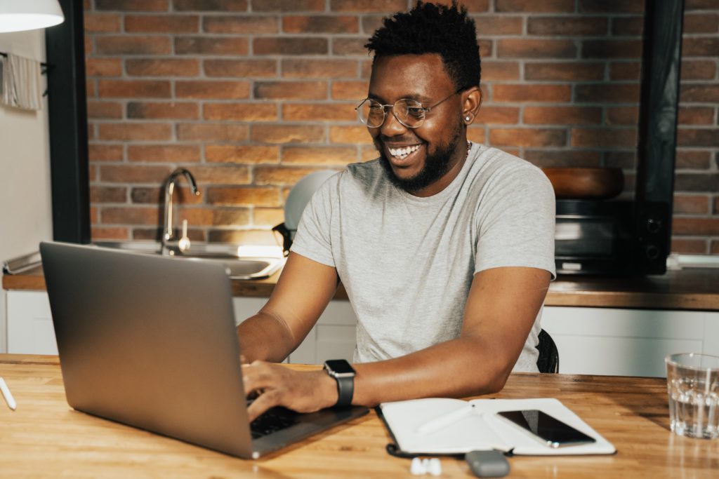 A man in front of a computer.