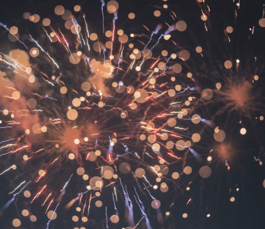 Unique Corporate Gifts for Employees and Clients 2024 A firework exploding with glimmering embers, expressing celebration.