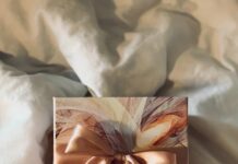 Everything You Need to Know to Find your Perfect Corporate Holiday Gift An ornate gift waiting to be opened with ribbons and gift wrap.