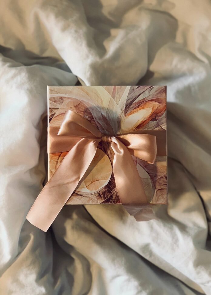 An ornate gift waiting to be opened with ribbons and gift wrap.