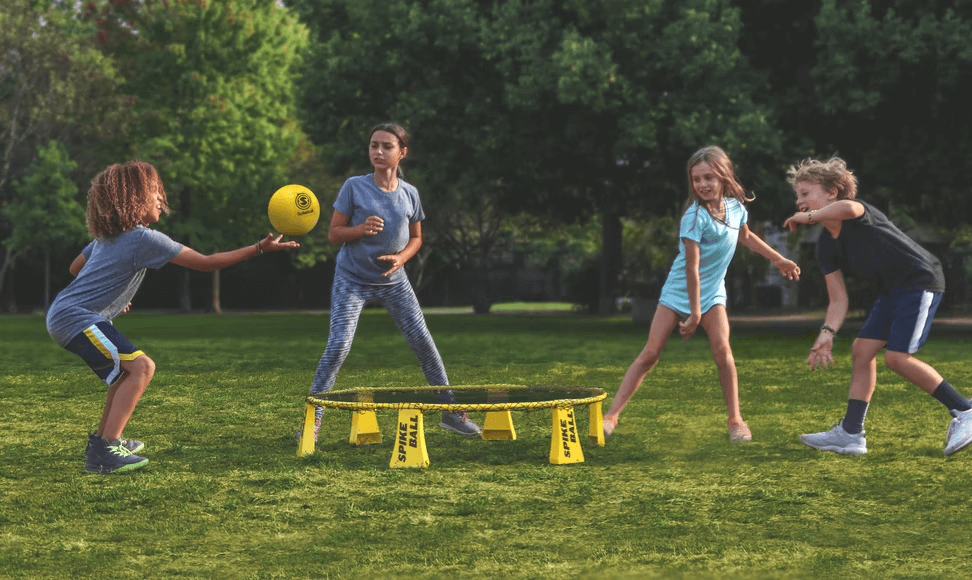 A group of young kids playing outside. 