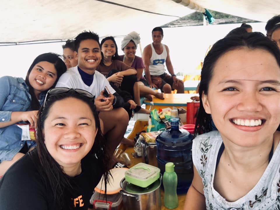 A group of family and friends enjoying  Filipino Birthday Traditions outside in the fresh air.